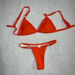 Size S bikini set color is orange red because of flash kinda fits tight